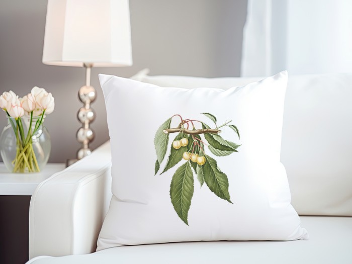 Spring themed accent pillow on a couch. 